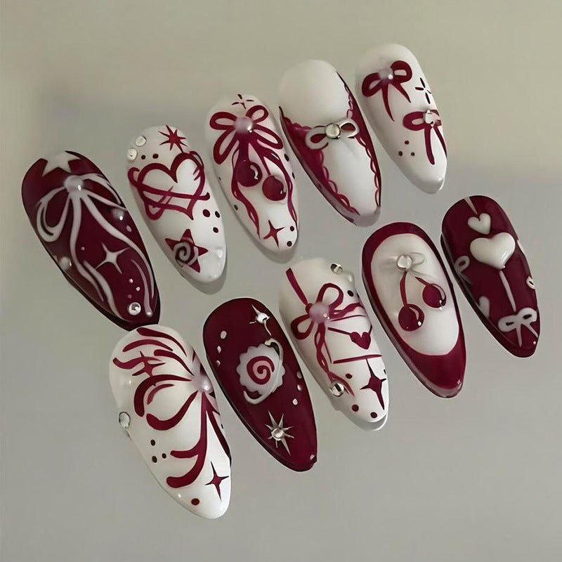 Kunstnagel Set mit romantischen Schleifen- und Blütenmotiven Brehn