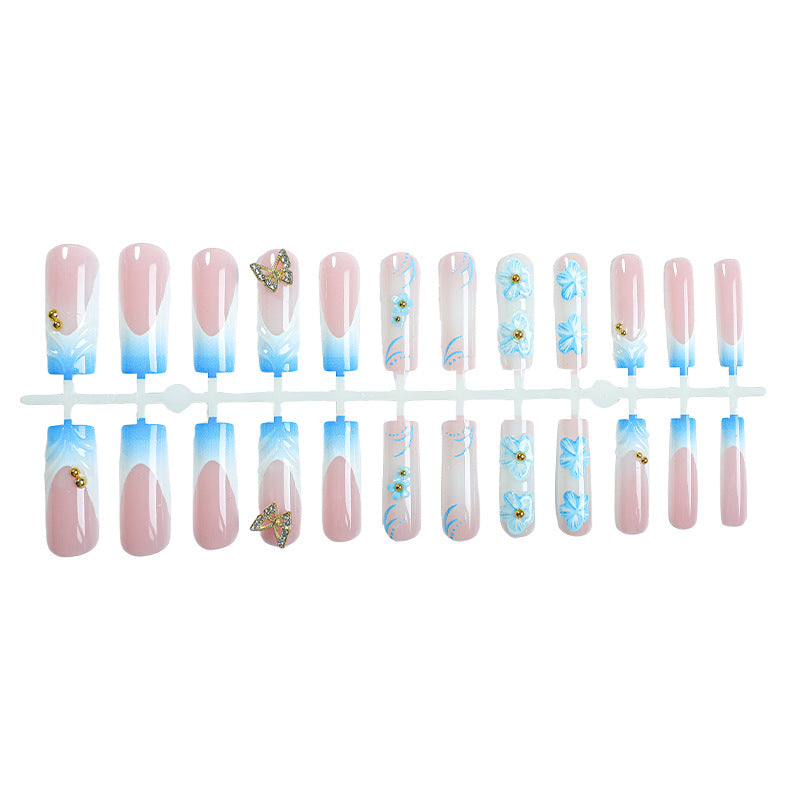 Künstlerisches Press-On-Nagel-Set mit floralen und Schmetterlingsdesigns Brehn