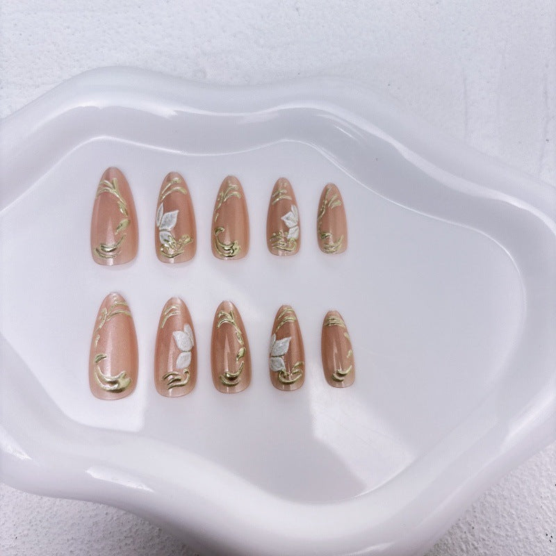 Elegante Kunstnägel mit Marmor- und Goldakzenten Brehn