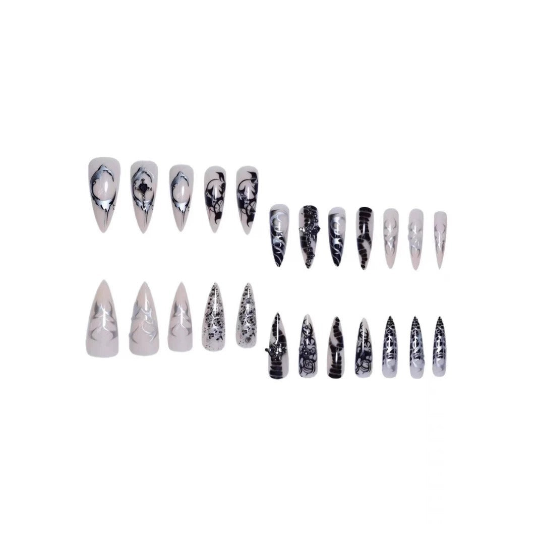 Künstlerische Stiletto-Nagelverlängerungen mit schwarzen Details Brehn