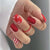 Kunstnagelset im festlichen Rot mit Glitzer- und Weihnachtsmotiven Brehn