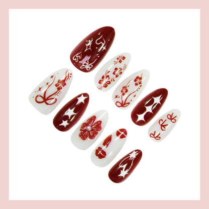 Kunstnagelset mit romantischen Herz- und Blütenmotiven Brehn
