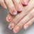 Kunstnagelset mit floralen Akzenten und glamourösen Dekoren Brehn