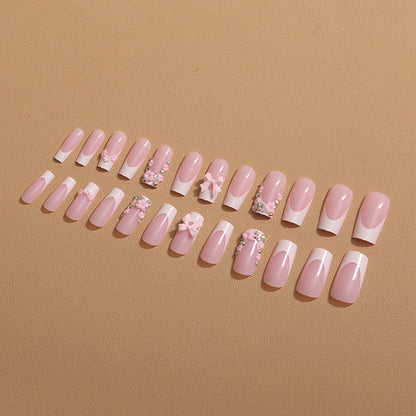 Kunstnagelset mit floralen 3D-Akzenten und Glitzerverzierungen Brehn