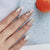 Künstlerisches Press-On-Nagelset mit eleganten floralen Akzenten Brehn
