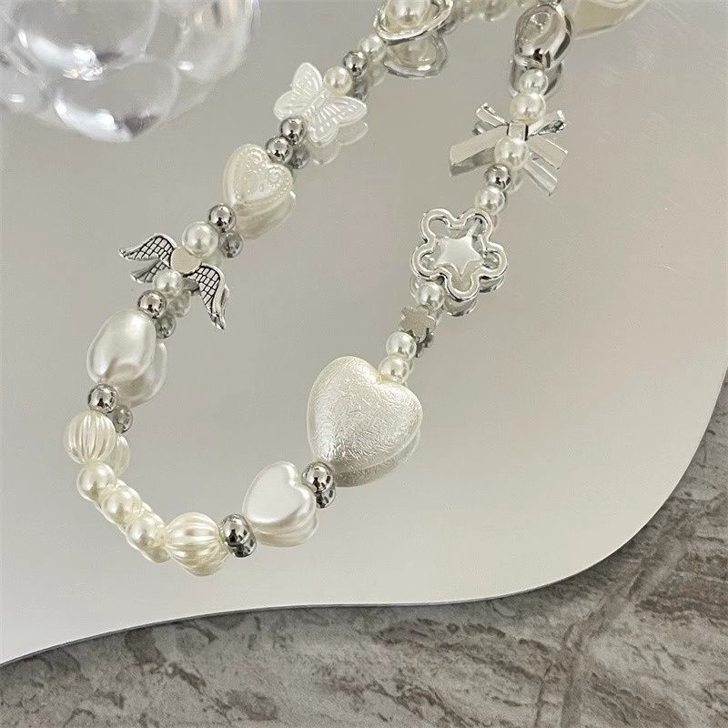Herz und Schmetterling Charm Perlenarmband Brehn