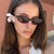 Damen ovalförmige Sonnenbrille mit transparentem Rahmen und UV-Schutz Brehn