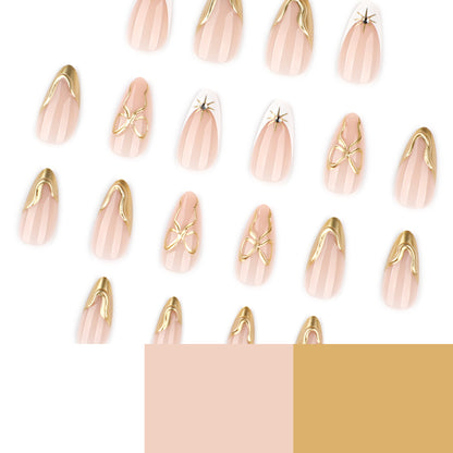 Kunstvolle Stiletto-Nägel mit eleganten Goldakzenten Brehn