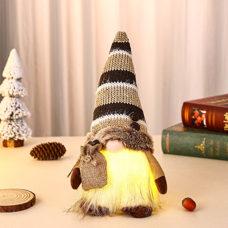 Dekorativer Weihnachtsgnom mit Geschenkpäckchen Brehn