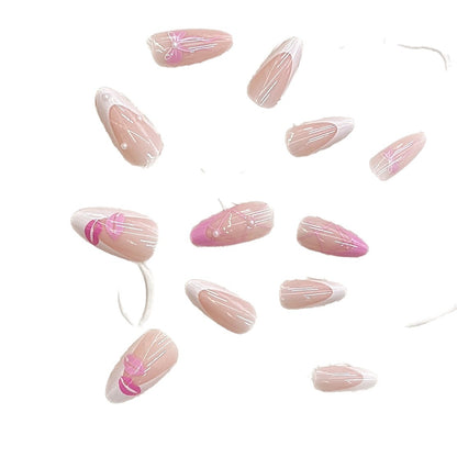 Künstlerisches Press-On Nagelset mit Kiss und Bow Design Brehn