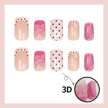 Kunstnagelset mit verspielten Blüten- und Punktmotiv Brehn