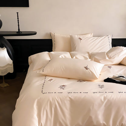 Bestickte Baumwollsatin Bettbezugset mit floralem Muster und Schriftzug-Rand