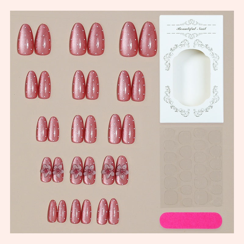 Kunstnagelset mit glamourösem Glitzer-Design und floralem Akzent Brehn