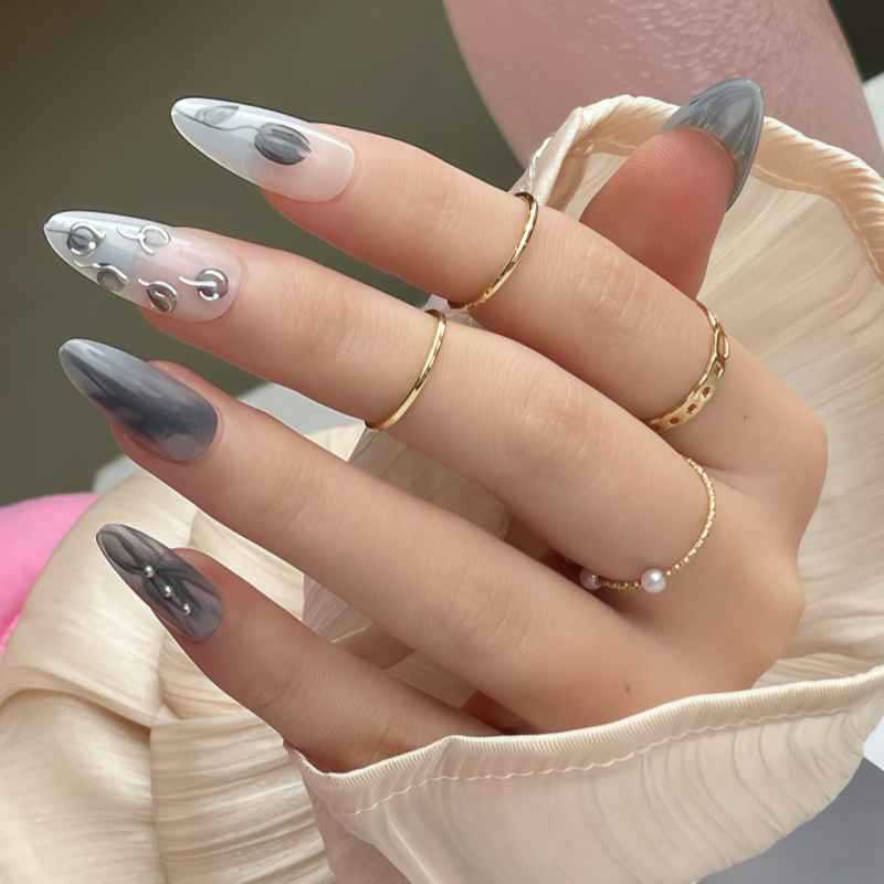 Künstlerisches Stiletto Presse-auf-Nageldesign mit zeitgenössischen Akzenten Brehn