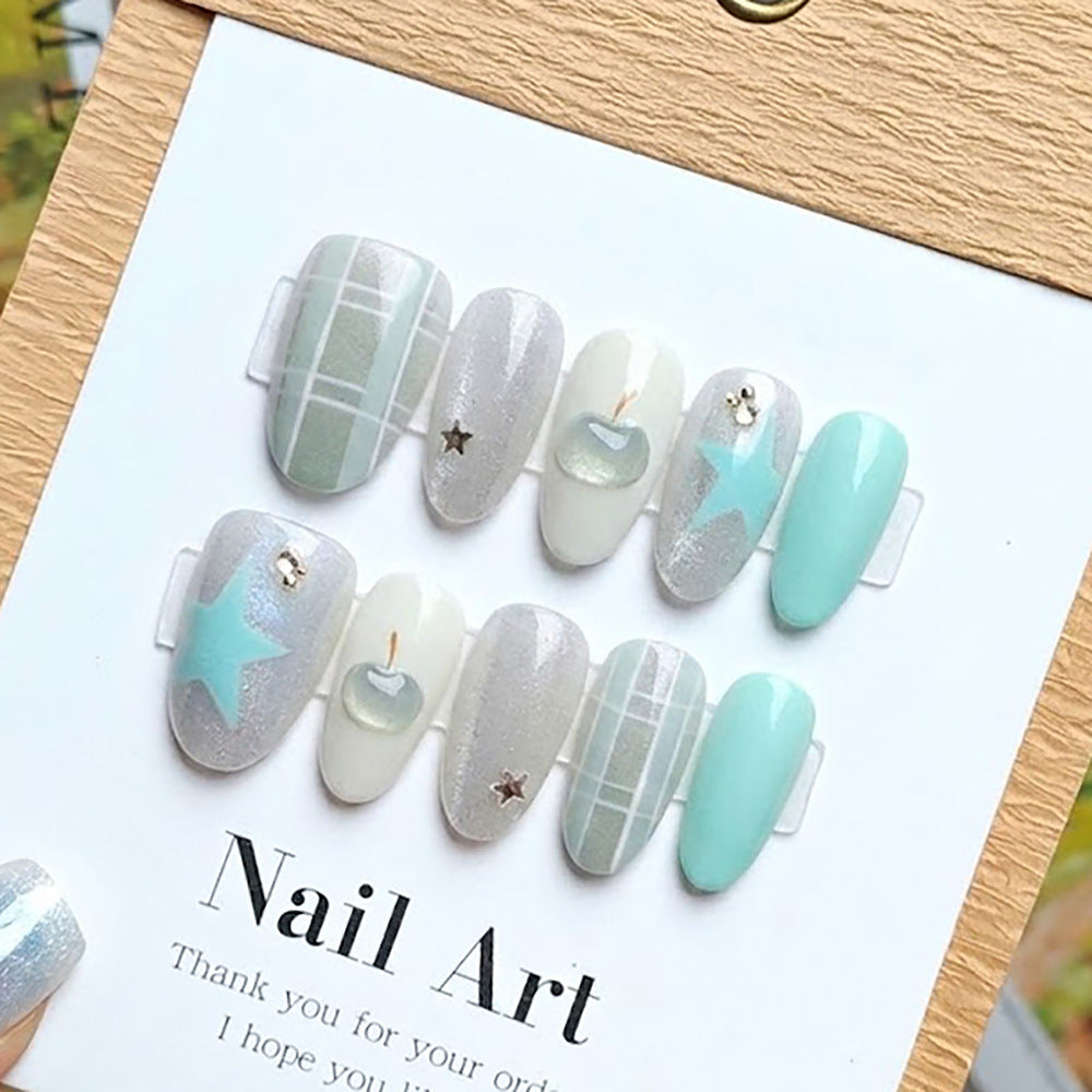 Künstlerisches Press-On Nagelset mit Stern- und Apfelmotiven Brehn