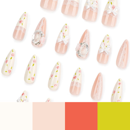 Kunstvolle Stiletto-Nägel mit floralen Akzenten und Glitzerakzenten Brehn