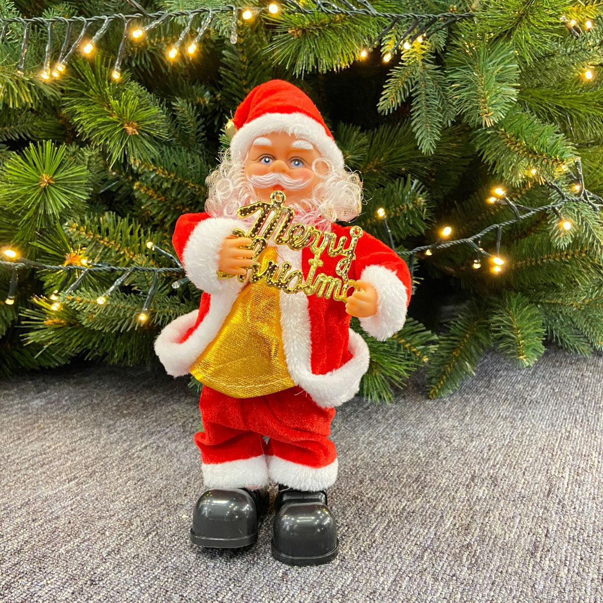 Niedlicher Weihnachtsmann mit Weihnachtsgruß-Schild Brehn