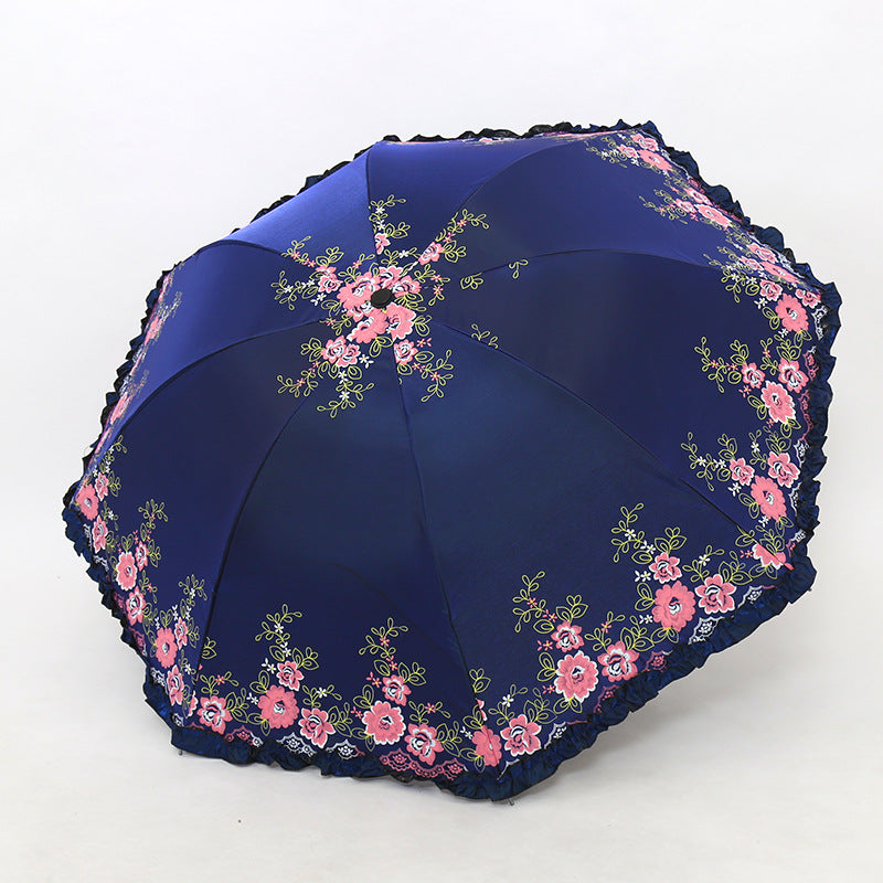 Damen Regenschirm mit fröhlichem Blumendruck und Wellenrand Brehn