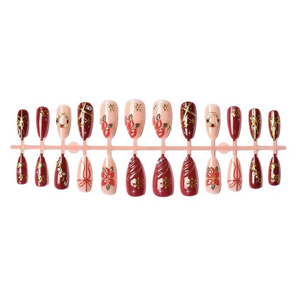 Kunstnagelset mit luxuriösen Weihnachtsmotiven und glamourösen Akzenten Brehn