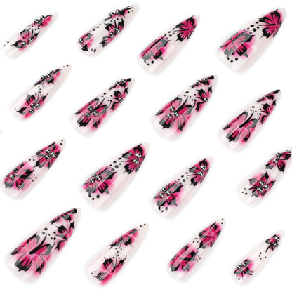 Kunstvolle Nagelkunst mit Blumen-Design und Strass-Akzenten Brehn