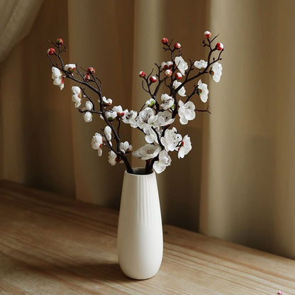 Dekorative Blumenäste Arrangement