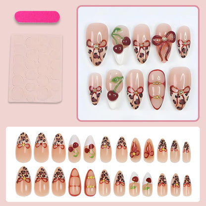 Kunstnagelset mit kreativen Schleifen- und Fruchtdesigns Brehn