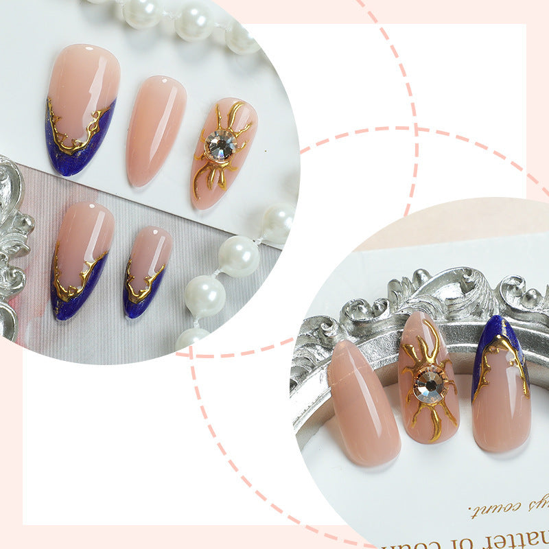 Kunstnagelset mit elegantem gold-blauen Design Brehn