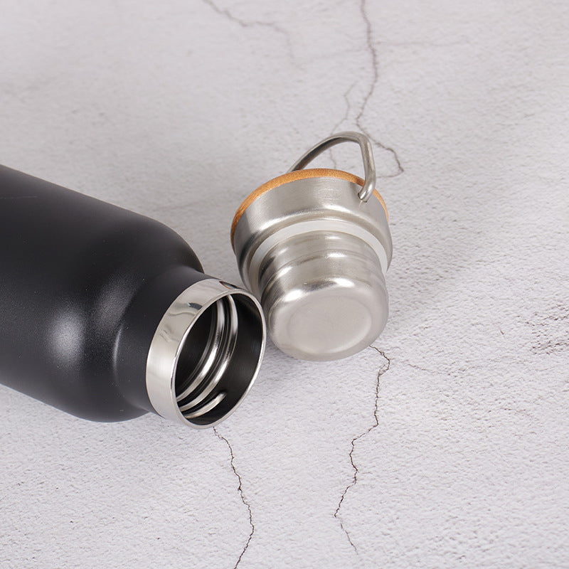 Damen Edelstahl Trinkflasche mit Bambusdeckel und Tragegriff Brehn