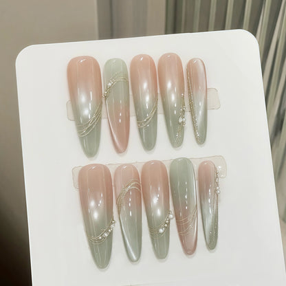 Dekorativer Press-On-Nagel-Set mit elegantem Gradient und Juwelenakzenten