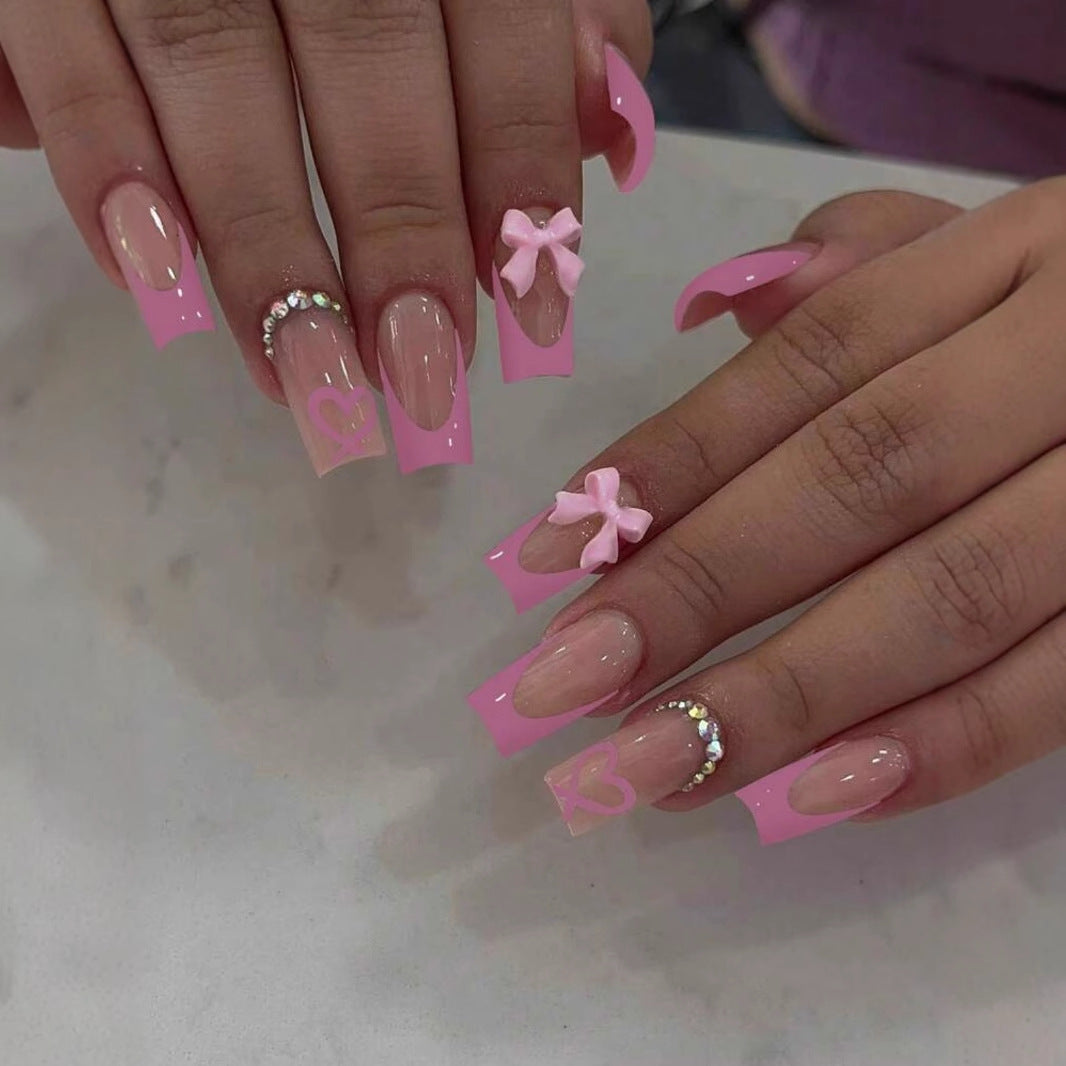 Kunstnagelset mit romantischen Schleifen- und Herzmotiven Brehn
