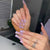 Kunstnagelset mit funkelnden Herzen und eleganten Glitzerakzenten Brehn