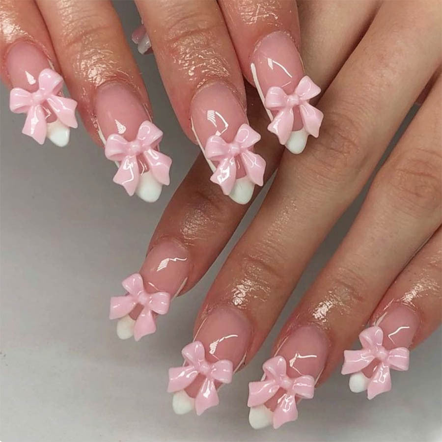 Kunstnagelset mit verspielten Schleifenakzenten Brehn