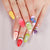 Kreatives Kunstnagelset mit bunten Obstdesigns Brehn