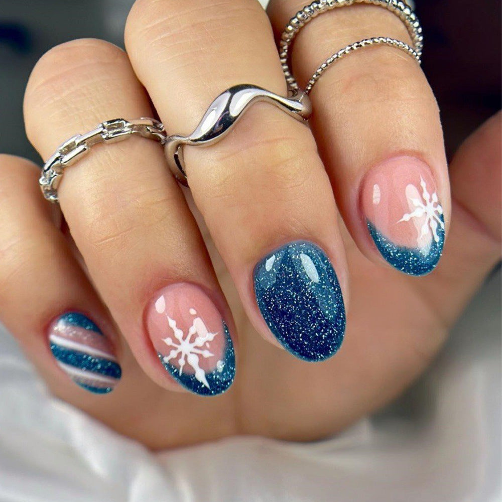 Kunstnägel mit Glitzerndem Blau und Floralem Design Brehn