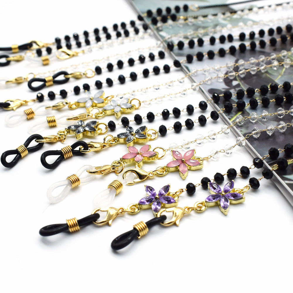 Eleganter mit Blumenakzenten verzierter Brillenketten Brehn