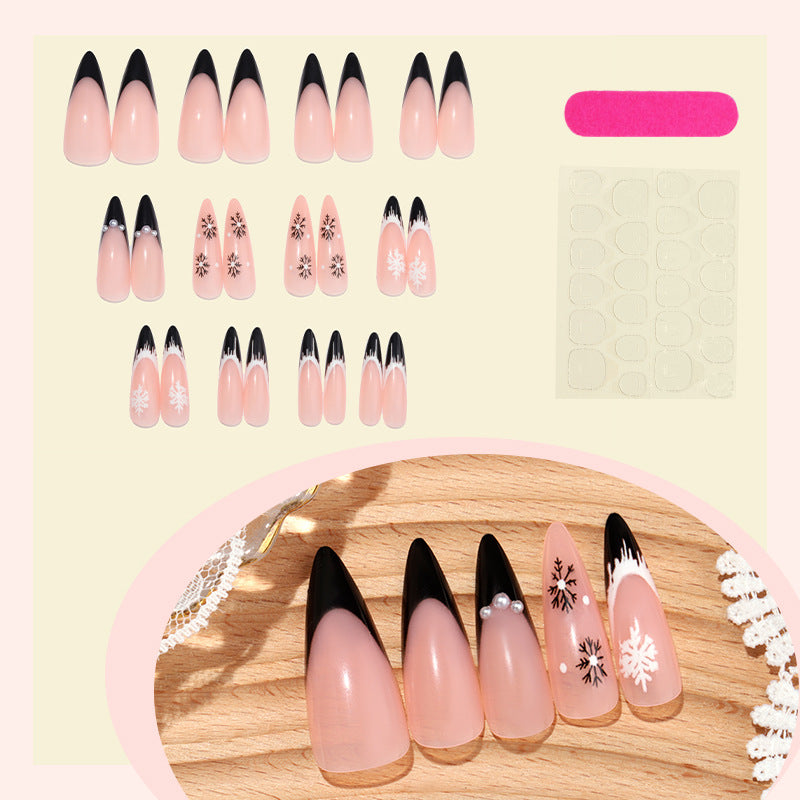 Künstlerisches Stiletto Press-On Nagelset mit dekorativen Schneeflocken-Designs Brehn