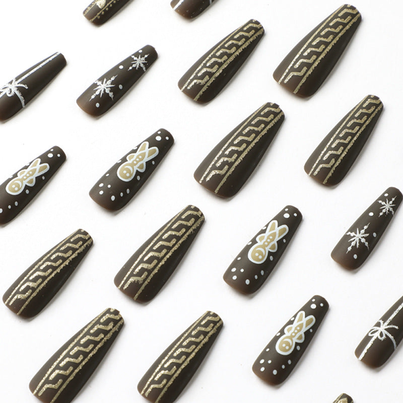 Künstliche Nagelkunst mit festlichem Lebkuchen-Design Brehn