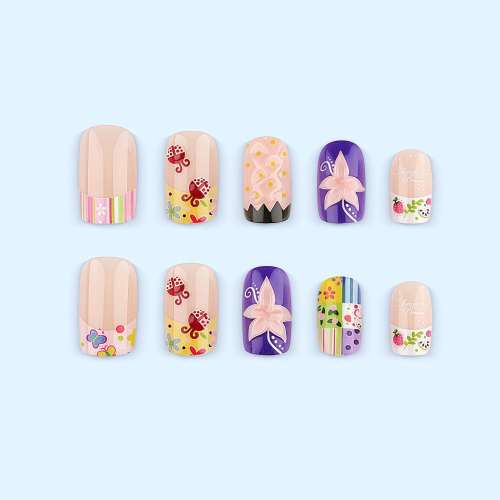 Kreative Kunstnagelset mit fröhlichen Mustern und Blumendesigns Brehn
