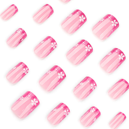 Kunstvolle Nagelkunst mit floralem Akzent und Glitzer Brehn