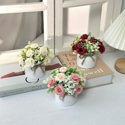 Lebensechter Blumenstrauß in dekorativem Topf für die wohnkultur