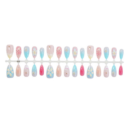 Kunstnägel Set mit floralen Designs und glitzernden Akzenten Brehn