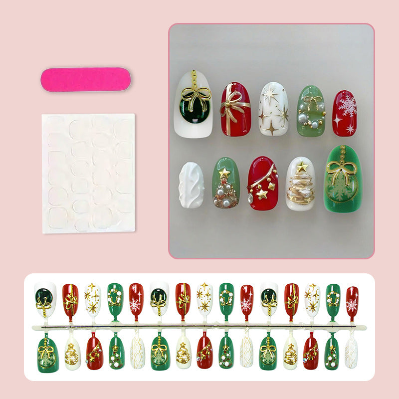 Kunstnagelset mit festlichen Weihnachtsmotiven und glamourösen Goldverzierungen Brehn