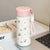 Damen Isoliertrinkflasche mit praktischem Trageband und verspieltem Design Brehn