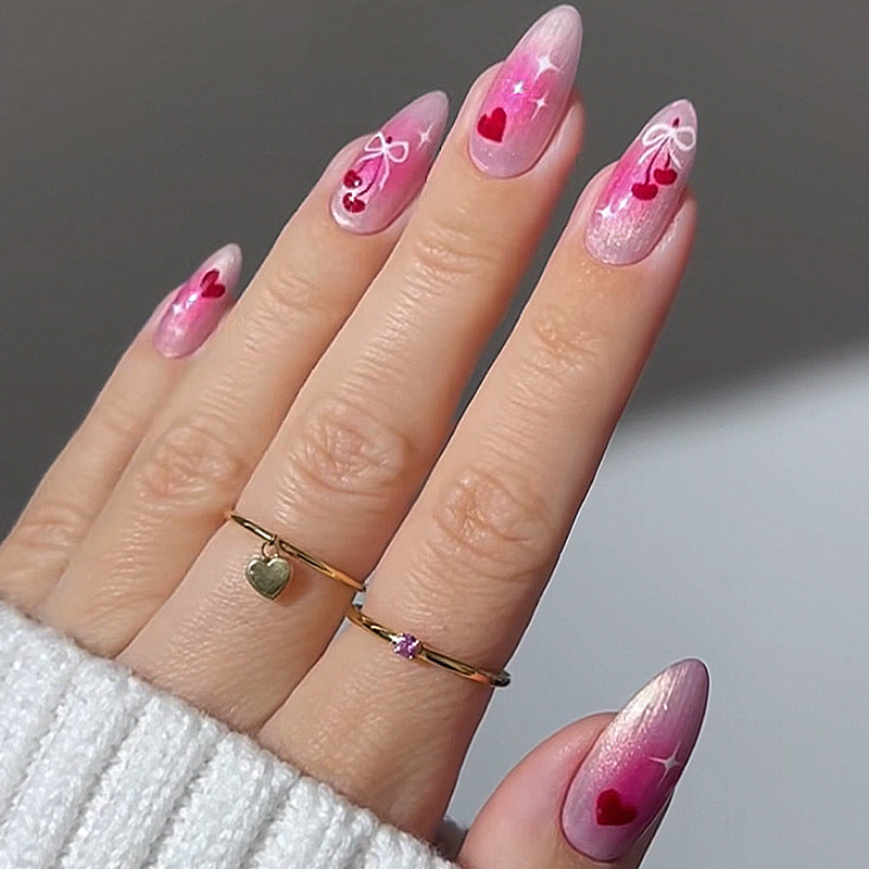 Charmante Acryl Press-On Nägel Set mit Herz- und Schleifenmotiven Brehn