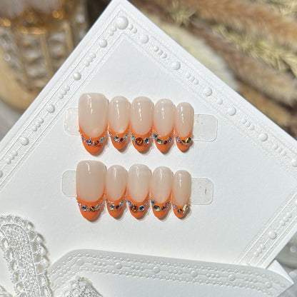 Dekorativer Press-On-Nagelset mit Rhinstein-Akzenten Brehn