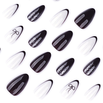 Kunstvolle Nagelkunst mit elegantem Schleifenmuster und Glitzer akzenten Brehn