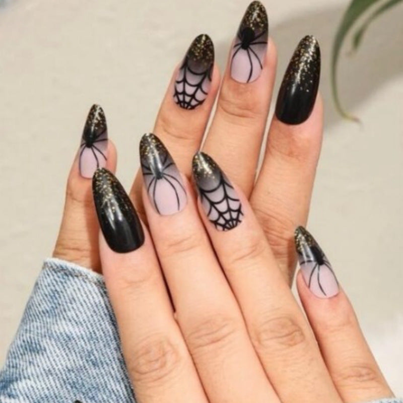 Künstlerisches Press-On Nagelset mit Glitzer und Spinnennetzdesign Brehn