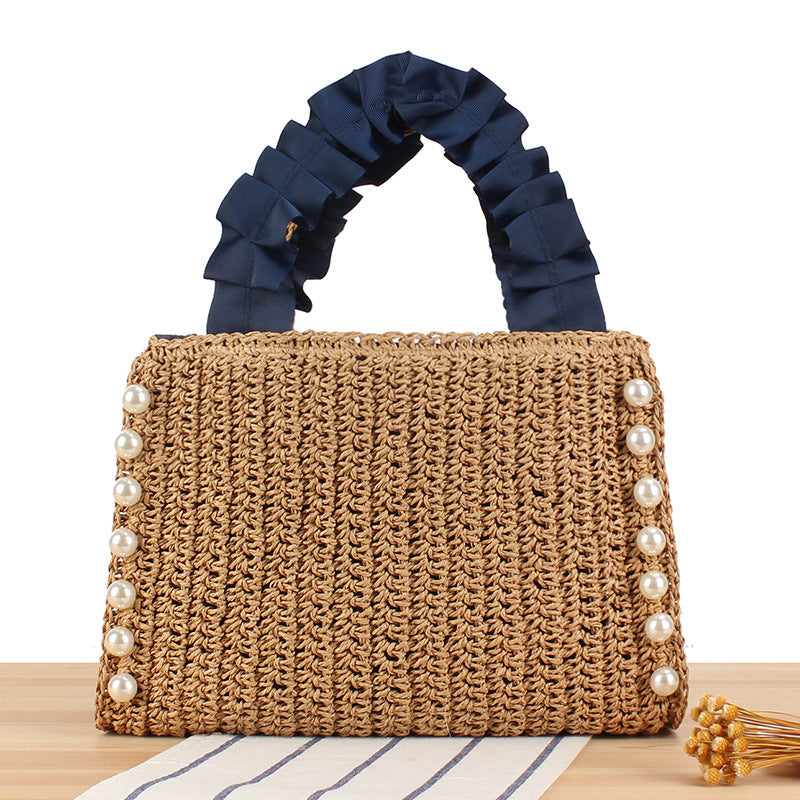 Elegante Handtasche mit Perlenverzierung und Rüschengriff Brehn