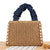 Elegante Handtasche mit Perlenverzierung und Rüschengriff Brehn