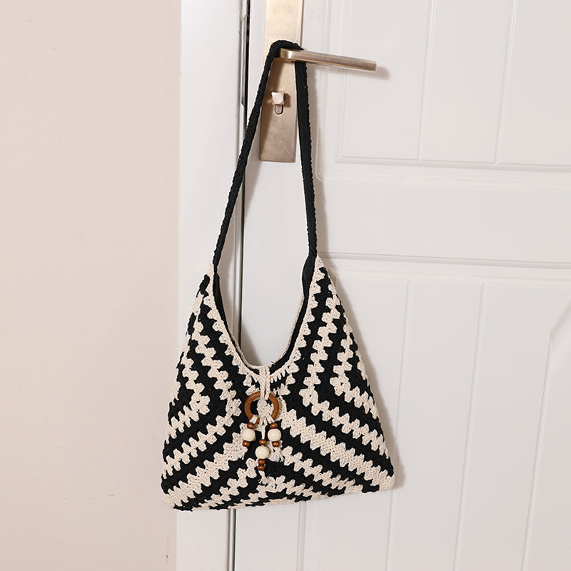 Damen Handtasche mit kunstvollem Flechtmuster Brehn